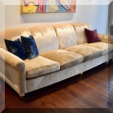 F13. Custom velvet sofa. 32”h x 108”w x 35”d 